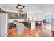 Well-lit kitchen with stainless steel appliances, an island, and an open floorplan at 613 Ravens Wood Rd, Summerville, SC 29486