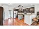 Modern kitchen with stainless steel appliances, granite countertops, and a center island at 613 Ravens Wood Rd, Summerville, SC 29486