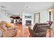 Cozy living room with fireplace, hardwood floors, and comfortable seating at 613 Ravens Wood Rd, Summerville, SC 29486