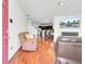 Open-concept living room featuring fireplace, hardwood floors, and open access to kitchen at 613 Ravens Wood Rd, Summerville, SC 29486