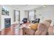 Bright living room with hardwood floors, fireplace, and comfortable furniture at 613 Ravens Wood Rd, Summerville, SC 29486