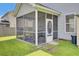 Screened-in porch featuring outdoor dining set, with a view of the backyard at 613 Ravens Wood Rd, Summerville, SC 29486