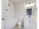 Modern bathroom featuring subway tile, shiplap, a tub and shower combo, and updated fixtures at 656 Coleman Blvd # 402, Mount Pleasant, SC 29464