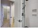 Modern bathroom shower with white tiled walls, built-in niches, and matte black fixtures at 656 Coleman Blvd # 402, Mount Pleasant, SC 29464