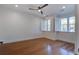 Bright bedroom with hardwood floors, recessed lighting, and windows fitted with classic white shutters at 656 Coleman Blvd # 402, Mount Pleasant, SC 29464