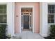 Inviting front entry with a stylish black door, elegant columns, and a warm, welcoming light fixture at 656 Coleman Blvd # 402, Mount Pleasant, SC 29464