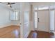 Inviting foyer with hardwood floors, leading into a bedroom with plantation shutters at 656 Coleman Blvd # 402, Mount Pleasant, SC 29464