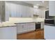 Modern kitchen features white cabinets, granite countertops, and stainless steel appliances, offering style and functionality at 656 Coleman Blvd # 402, Mount Pleasant, SC 29464