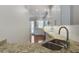 Well-equipped kitchen features white cabinets, granite countertops, stainless appliances, subway tiles, and an exterior view at 656 Coleman Blvd # 402, Mount Pleasant, SC 29464