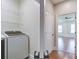 Convenient laundry area with washer and dryer hookups, shelving, and easy access to the bedroom at 656 Coleman Blvd # 402, Mount Pleasant, SC 29464