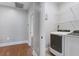 Functional laundry area with modern appliances, shelving and convenient access to other rooms at 656 Coleman Blvd # 402, Mount Pleasant, SC 29464
