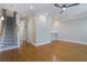 Open living room with hardwood floors, recessed lighting, ceiling fan, and a staircase leading to the upper level at 656 Coleman Blvd # 402, Mount Pleasant, SC 29464