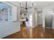 Open-concept living area with hardwood floors flowing into the kitchen, showcasing ample space and natural light at 656 Coleman Blvd # 402, Mount Pleasant, SC 29464