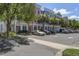 Picturesque street with colorful townhomes, mature trees, and convenient parking spaces at 656 Coleman Blvd # 402, Mount Pleasant, SC 29464