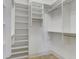 Organized walk-in closet with built-in shelving and ample storage space at 656 Coleman Blvd # 402, Mount Pleasant, SC 29464