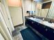 A clean bathroom with tile floors and a counter with two sinks at 700 Daniel Ellis Dr # 2203, Charleston, SC 29412