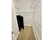 Walk-in closet with white wire shelving and a storage safe at 700 Daniel Ellis Dr # 2203, Charleston, SC 29412