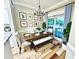 Inviting dining room with a farmhouse-style table, bench, and tasteful decor at 700 Daniel Ellis Dr # 2203, Charleston, SC 29412