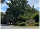 Community entrance sign surrounded by lush greenery, offering a welcoming first impression at 700 Daniel Ellis Dr # 2203, Charleston, SC 29412