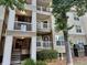 Exterior view of a multi-story apartment building with private balconies and outdoor staircases at 700 Daniel Ellis Dr # 2203, Charleston, SC 29412