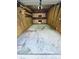 Empty garage interior with built-in cabinets and workspace, offering versatile storage options at 700 Daniel Ellis Dr # 2203, Charleston, SC 29412