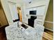 Modern kitchen featuring stainless sink, granite countertops, white cabinets, and sleek appliances at 700 Daniel Ellis Dr # 2203, Charleston, SC 29412
