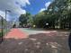 Exterior shot of a tennis court, with surrounding trees and residential building in the background at 700 Daniel Ellis Dr # 2203, Charleston, SC 29412