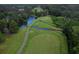 An aerial view of a beautiful green golf course with winding streams and paths through the community at 806 Westos Way, Mount Pleasant, SC 29464
