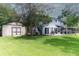 Expansive backyard with a storage building, outdoor seating and screened-in porch at 806 Westos Way, Mount Pleasant, SC 29464