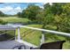 Beautiful backyard view of the golf course from the balcony with a pond and lush greenery at 806 Westos Way, Mount Pleasant, SC 29464