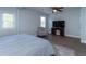 A light and airy bedroom with light blue walls, ceiling fan, a TV and neutral colored furniture at 806 Westos Way, Mount Pleasant, SC 29464