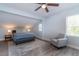 A light and airy bedroom with light blue walls, ceiling fan and neutral colored furniture at 806 Westos Way, Mount Pleasant, SC 29464