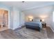 A light and airy bedroom with light blue walls and view into the adjacent bathroom at 806 Westos Way, Mount Pleasant, SC 29464