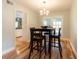 Bright dining area features modern lighting, wood floors, and sliding doors to extend living to the outside at 806 Westos Way, Mount Pleasant, SC 29464