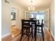 A quaint dining area with light green walls, hardwood floors, and an open floor plan at 806 Westos Way, Mount Pleasant, SC 29464