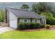 Charming home featuring a well-manicured lawn, mature trees, and a two-car garage at 806 Westos Way, Mount Pleasant, SC 29464