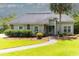 Inviting single-story home with a stone-lined walkway, mature landscaping, and a lovely front yard at 806 Westos Way, Mount Pleasant, SC 29464
