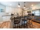 Kitchen island with seating, pendant lights, granite counters and stainless appliances at 806 Westos Way, Mount Pleasant, SC 29464