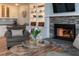Cozy living room featuring a fireplace with stone surround, built-in shelving, and comfortable seating at 806 Westos Way, Mount Pleasant, SC 29464