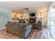 Comfortable seating area with large couches, fireplace, built-in shelving, and natural light at 806 Westos Way, Mount Pleasant, SC 29464