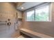 Beautiful shower with bench seating, tiled walls, and a shower head at 806 Westos Way, Mount Pleasant, SC 29464