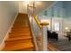 Elegant staircase featuring wooden steps, modern railings, and bright light at 806 Westos Way, Mount Pleasant, SC 29464
