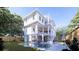 Stunning backyard featuring a pool, outdoor grilling area, and white exterior of a charming home at 814 Palm Blvd, Isle of Palms, SC 29451
