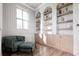 Cozy living room with built-in shelves, a comfortable sofa, and natural light at 814 Palm Blvd, Isle of Palms, SC 29451