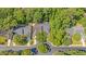 An aerial view of a well-planned neighborhood with mature trees and manicured lawns at 9117 Woodcreek Ct, North Charleston, SC 29406