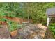Private backyard featuring a hammock, mature trees, a wood fence, and lush landscaping at 9117 Woodcreek Ct, North Charleston, SC 29406