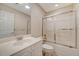 Bathroom featuring tub with glass doors, vanity with sink, and tiled floors at 9117 Woodcreek Ct, North Charleston, SC 29406