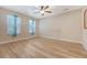 Well-lit bedroom featuring natural light, light wood flooring and ceiling fan at 9117 Woodcreek Ct, North Charleston, SC 29406