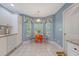 Eat-in kitchen with sunlit windows, a breakfast nook, tile floors and stylish blue walls at 9117 Woodcreek Ct, North Charleston, SC 29406