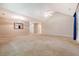 Spacious living room featuring vaulted ceilings and light-colored carpet at 9117 Woodcreek Ct, North Charleston, SC 29406